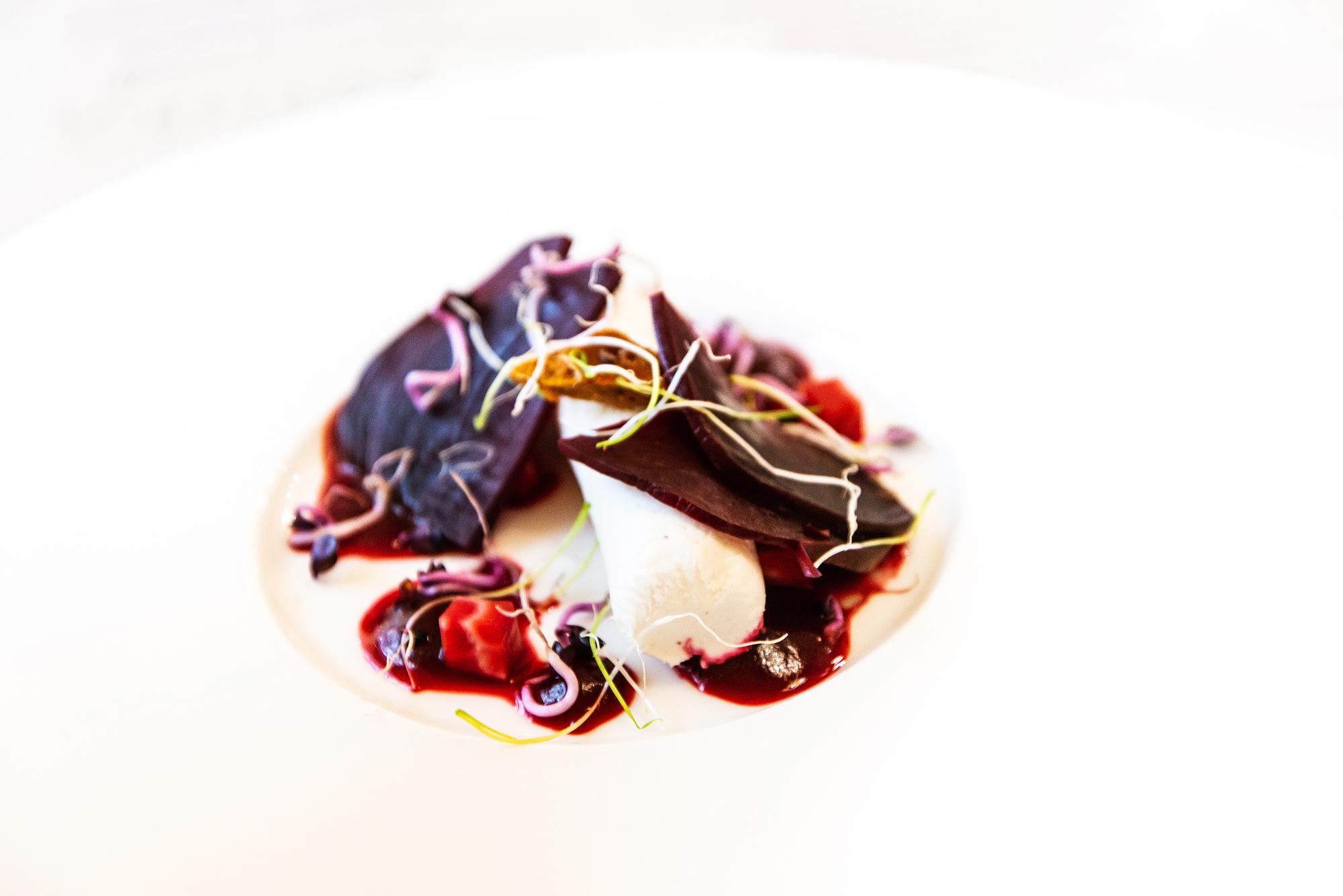 Close-up of plated signature dish with geometric garnish